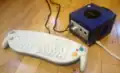 A GameCube setup for online play, with keyboard controller and broadband adapter installed.