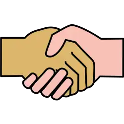 An image of two shaking hands of different races.