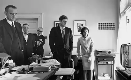President Kennedy watches the flight of Alan Shepard on Television.