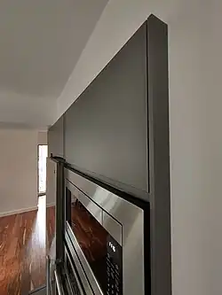 Notice the cover panel at the side of the cabinet.