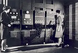 A Two women operating the ENIAC's main control panel while the machine was still located at the Moore School.