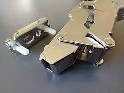 The little base piece goes in the cabinet frame.