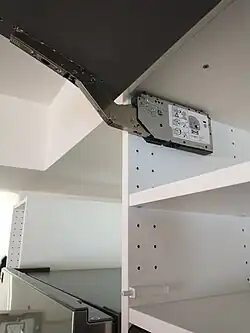 A hinge for a horizontal door, before…