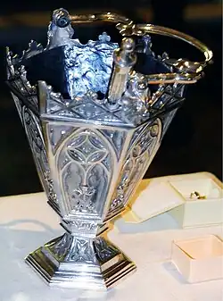 Aspersory - a brush or small perforated container with a handle that is used for sprinkling holy water in a liturgical service