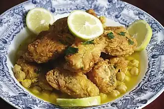 Traditional Algerian dish caleed yahne made of chicken fritters and a spicy sauce