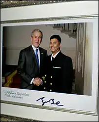 President George W. Bush congratulates Chaplain Imam Abuhena Saifulislam, the first US Navy Muslim chaplain assigned to the Marine Corps.