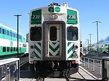 Image 28This cab car includes a horn (top), a bell (top right), headlights (above the door), classification lights (red lights on side), and ditch lights (white lights on side). (from Train)