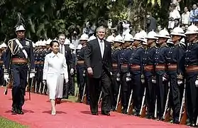 President Gloria Macapagal Arroyo and U.S. President George W. Bush participating at an arrival ceremony at the Malacañang Palace in Manila, October 18, 2003