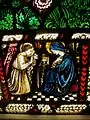 One of three vignettes at the base of the window. The Annunciation. Gabriel tells Mary the good news.