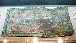 An etched copper slab, with gold and silver added to it.