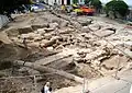 Archaeological excavations at St. Michael's Square, revealing the foundation outline of the church