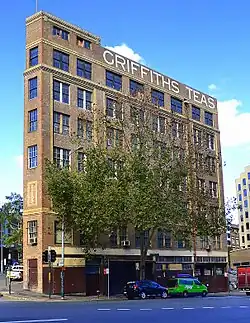 Griffiths Teas building in Sydney, viewed from Wentworth Ave, with Commonwealth St on left. The facades facing these streets form an acute angle. (May 2014)
