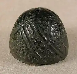 Cast 14th century thimble.