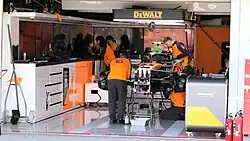 MCL39 being assembled in the pit building prior to the 2025 Japanese Grand Prix