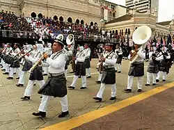 The marching band of the Royal Malaysian Police parading in ceremonial uniforms