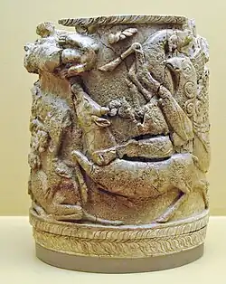 Ancient Greek ivory pyxis with griffins attacking stags. Late 15th century BC