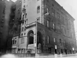 A black-and-white image of the entrance pavilion at 24 East 51st Street in 1977. The pavilion, a covered porch, is accessed through a short flight of steps.