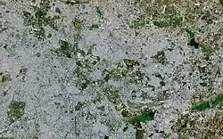 A satellite image from 2018. It is covered with the city area. Big lakes such as Bellandur are visible.