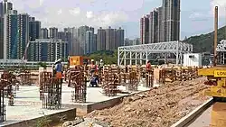 Workers installing building foundations