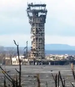 An observation tower, heavily damaged from artillery fire