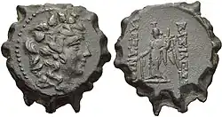 Coin of Alexander II. On the obverse, the bust of the god Dionysus surrounded by ivy leaves is shown. On the reverse the statue of a standing winged Tyche is depicted