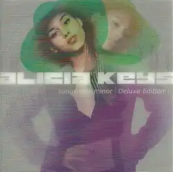 Keys facing forward and standing in front of a transparent clone of herself