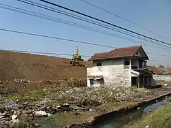 Area of destruction, with earth embankment in background