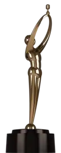 Gold art deco figurine of a person wearing headphones and holding a microphone above their head. Statuette rests on a circular black base.