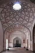 Side chambers also feature geometric ceiling designs