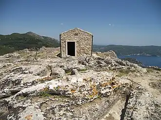 The church of Archangel Michael at Angelokastro with anthropomorphic graves at the foreground]]