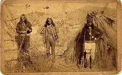 Chiricahua Apache warriors. Left to right: "Massai", "Apache Kid", and "Rowdy" pictured in a March 1886 photograph taken by C. S. Fly at Geronimo's camp.