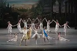 Victor Baranov as the god Apollo, Eugenia Obratzova as the goddess Flora and Maxim Chaschegorov as the god Zephyr with the corps de ballet in the Mariinsky Ballet's reconstruction of Le Réveil de Flore. St. Petersburg, 2007
