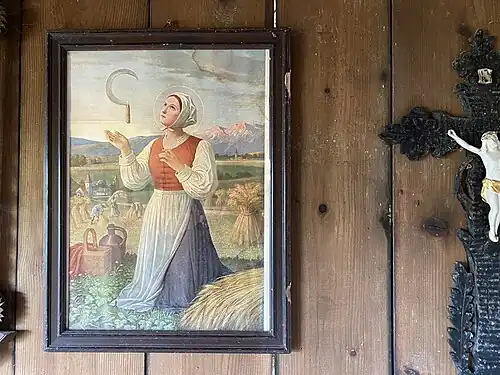 Saint Notburga next to a crucifix, Bavaria