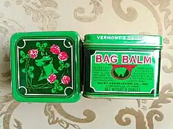 metal container of bag balm shown in top and side view