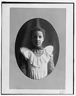 A young woman facing the camera