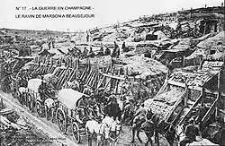 A fort in Marson Ravine, Beauséjour. There are people riding horses and horse-drawn carts.