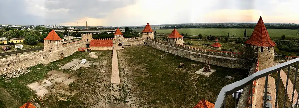 The remnants of Bender fortress wall with modern city skyline in the background