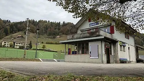 Two-story station building with gabled roof