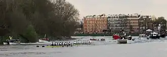 Two rowing eights rounding the last bend of the race course on the River Thames