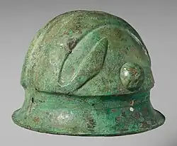 Colour photograph of a hemispherical helmet with deep brim