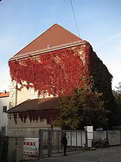 Rectangular concrete air-raid shelter with small windows and blank walls