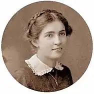 Smiling teen girl with braided hair looking to her right