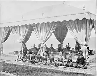 A gamelan ensemble with a group of singers (Sindhen (Female) and Gerong (Male)) at the Mangkunegaran Royal Palace in Surakarta, Central Java, between 1870 and 1892