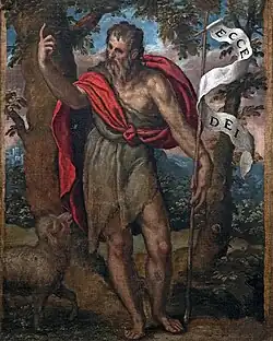 John the Baptist, depicted as an elderly man in a ragged tunic, holding a cross with a pennant, and pointing his right index finger upwards