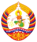 Logo of the Cambodian People's Party, featuring an angel spreading flowers, surrounded by golden rice stalks and a demi cogwheel, and party's name in Khmer on the ribbon