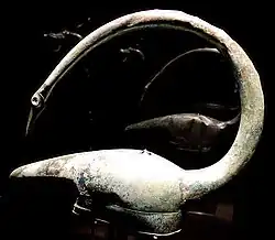 A helmet in the shape of the head of a bird, found at Tintignac