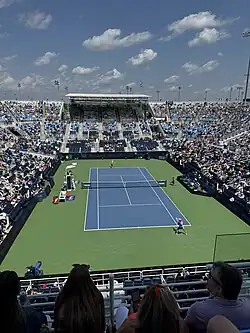 Mirra Andreeva serving against Iga Świątek at Center Court on August 17, 2024