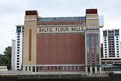 Picture of the brick façade of Baltic with its distinctive red and yellow bricks and original lettering.