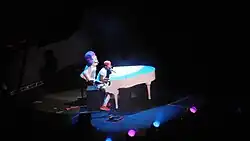 Chance the Rapper performs in 2016 at a piano.