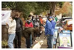 Frydenberg with volunteers at a polling place in Hawthorn at the 2022 election